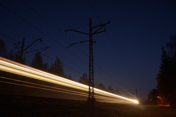 Fast moving train in the late evening