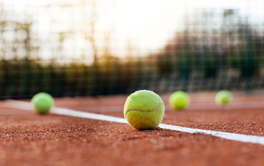 Tennis balls on tennis court.