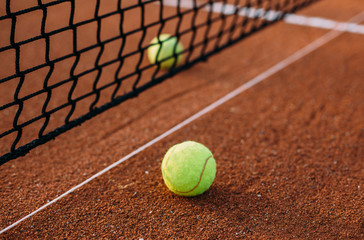 Tennis balls on tennis court.