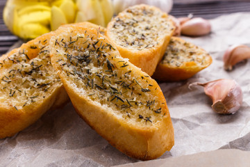 fragrant garlic bread on a rustic wooden background