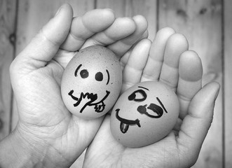 An egg staring lustfully, lecherously at another egg, both in female hands. Two eggs in love, being...