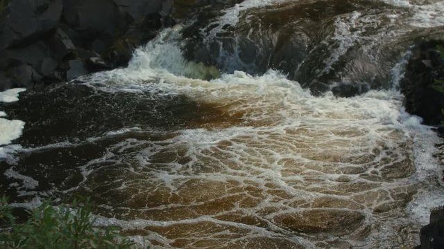 Waterfall powerful stream of water with foam and rocks in 4k 50 fps ready for slow motion