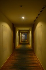 long hotel corridor with doors