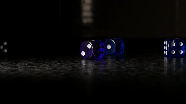 A small set of dice being rolled