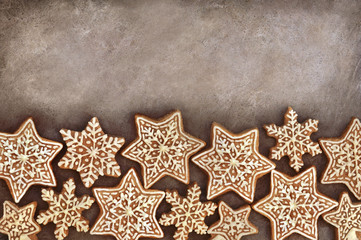 Homemade gingerbread cookies, festive Christmas and New Year sweeties background card, toned