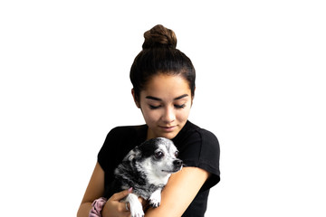 Beautiful mixed race teenage girl holding chihuahua dog isolated