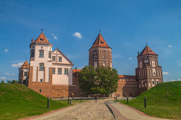 Naklejka premium View of the Mir castle on a beautiful sunny day of a summer in in the region of Grodno, in Belarus - Gothic style, the fortification is an UNESCO heritage site, also known as Mirsky zamok.