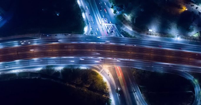 JAKARTA, Indonesia - October 15, 2018: Aerial hyperlapse footage of road interchange and overpass tollway at night in Jakarta city, Indonesia. Shot in 4k resolution