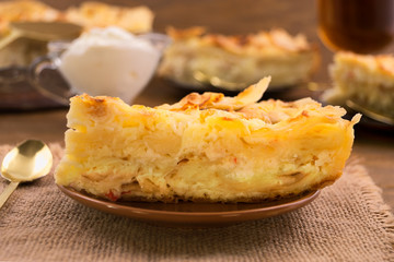 Cut a piece of the pie dough with a cottage cheese layer, a napkin of linen.