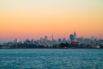 Fototapeta premium San Francisco Skyline Illuminated By the Setting Sun