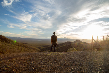 Fototapeta premium Man looks at the view in the desert