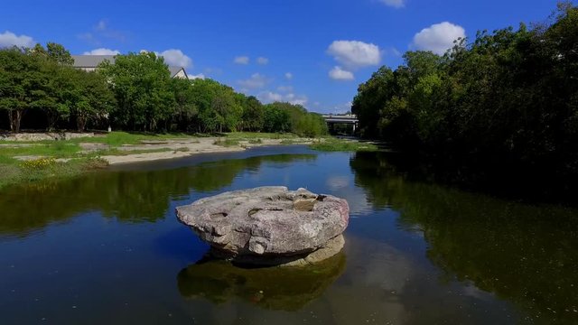The Brushy Creek Crossing at The Round Rock, a round table top rock in the middle of the crossing,and to this day the limestone bottom has ruts from the wagon wheels cut into it.