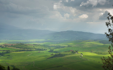 Fototapeta na wymiar Panoramic view of a spring day in the Italian rural landscape.