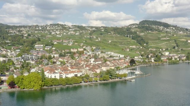 Fly by town of Lutry seen form Lake L&radic;&copy;man (Lake Geneva) Summer colors and reflections in the water.
Lutry, Lavaux - Switzerland