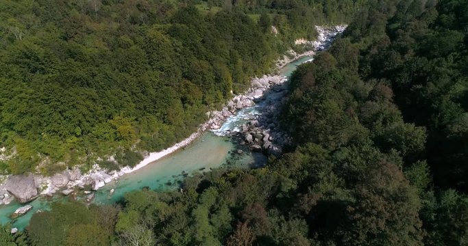 Aerial tilt out, drone view of a turquoise, soca river, in the slovenian alp nature, near Trigolov national park, on a sunny summer day, in the Julian alps, Slovenia.mp4