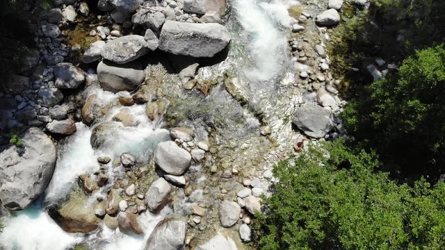 Spinning Drone Footage of a River in the Mountains of Corsica, France