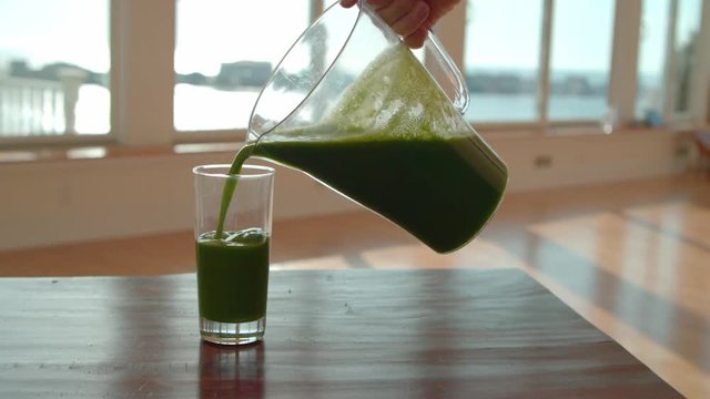 Poring healthy juice to a jug. Captured with Blackmagic cinema camera in 4K.