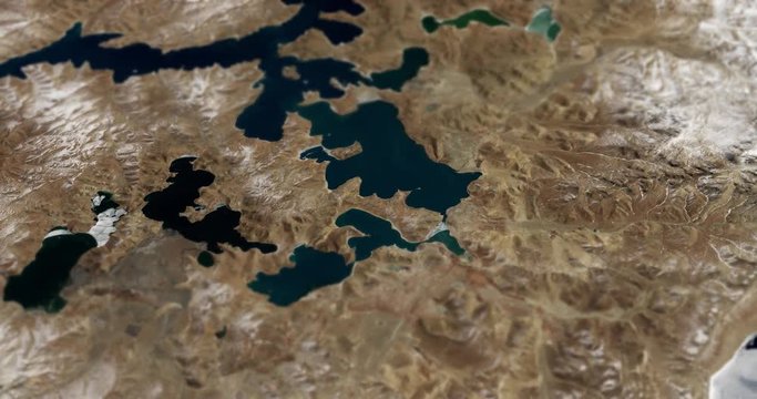 Very high-altitude circular tracking shot of Lake Puma Yumco, Tibet with tilt-shift effect. Reversible. Elements of this image furnished by NASA. 