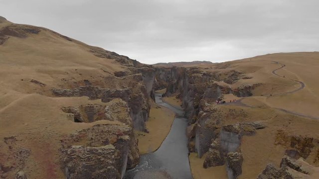 Cinematic aerial flyover of stunning Icelandic canyon.