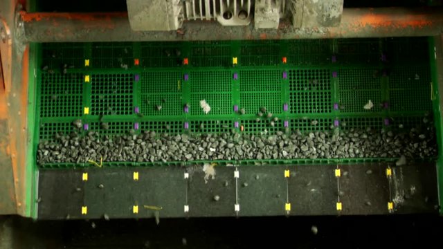 Rocks on sifter in mine.