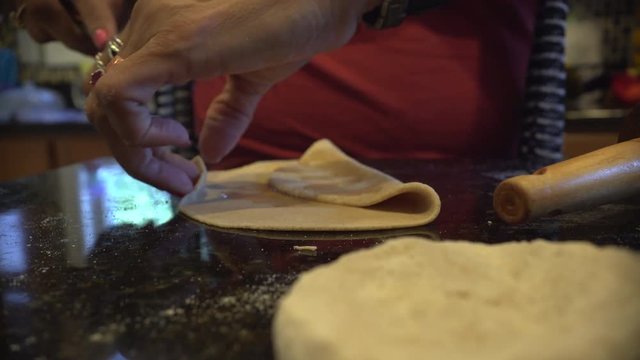 Making home made roti.