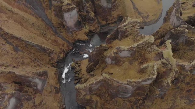 Cinematic aerial flyover of stunning Icelandic canyon.