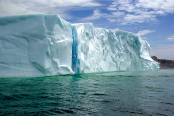 Large Floating Iceberg With Blue Glacier Ice Stripe