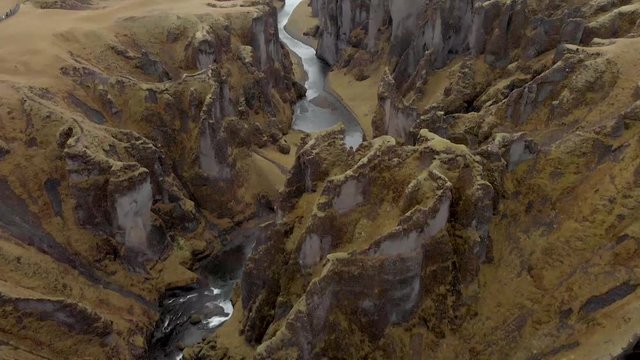 Cinematic aerial flyover of stunning Icelandic canyon.