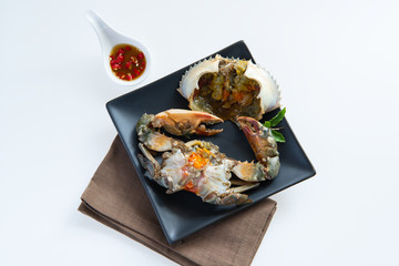 Fresh female Crab fermented  Pu Dong  with spicy chili,fish sauce,lime,whisky on white background . Recommended dishes in Thailand