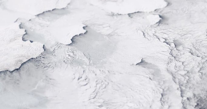 Very high-altitude circular tracking shot of ice in the Bering Sea with tilt-shift effect. Reversible. Elements of this image furnished by NASA. 