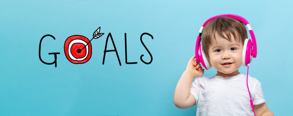 Goals with target with toddler boy with headphones on a blue background