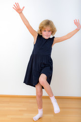 Girl is balancing on one leg