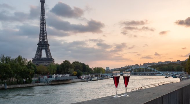 Tow Glasses of Wine on By the Siene River in Paris at Sunset