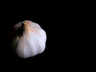  Garlic has a spigot on black background dark tone