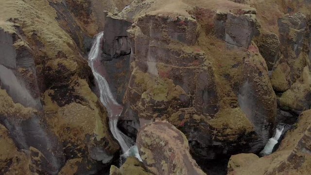 Cinematic aerial flyover of stunning Icelandic canyon.