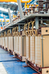 Internal active parts (core and coils) of transformer in production