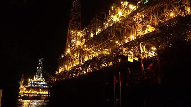 FPSO tanker vessel near Oil platform Rig. Offshore oil and gas industry, sea oil production and storage
