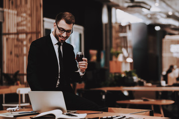 Brainstorm. Glass of Wine. Business Suit. Laptop.