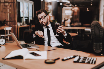 Wrist Watch. Glass Wine. Business Suit. Laptop.