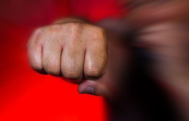 a man brutally hits with his fist