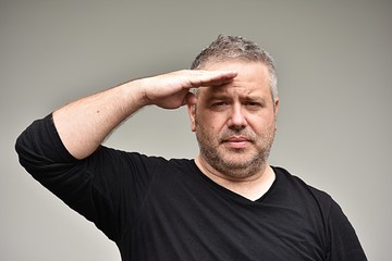 Obraz premium Unshaven Caucasian Male Saluting