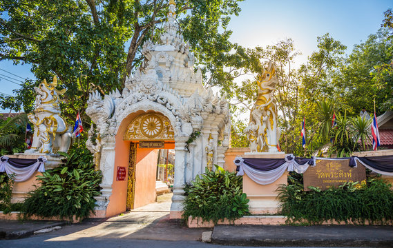 Wat Phra Singh temple is a buddhist temple located in Chiang Rai, northern Thailand. Landmark of Chiang Rai, Translation text in the image "Wat Phra Singh and Tha Luang Gate"