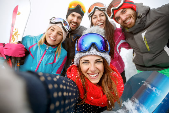 Happy skiers on mountain