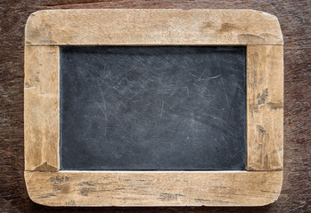 Blackboard with wooden frame, blackboard on old wood background