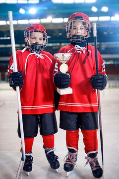happy boys players ice hockey winner trophy.