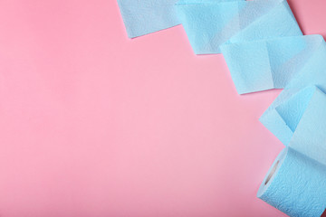Roll of toilet paper on color background, top view. Space for text