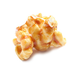 Delicious caramel popcorn on white background