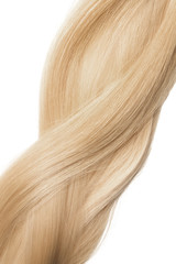 Fototapeta premium Strand of healthy blond hair on white background