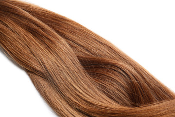 Fototapeta premium Locks of healthy red hair on white background