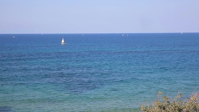 Small white yacht moving on Mediterranean sea